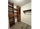Walk-in closet featuring custom shelving and drawers to provide maximum storage space at 3285 Rollingbrook Way, Duluth, GA 30096