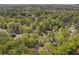 Expansive aerial view of a property nestled among lush green trees and landscaping at 4152 Barberry Ne Dr, Roswell, GA 30075