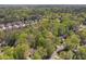 Scenic aerial view of a home surrounded by lush trees and landscaping at 4152 Barberry Ne Dr, Roswell, GA 30075