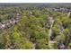 Serene aerial view of a property with mature trees in a peaceful and quiet residential neighborhood at 4152 Barberry Ne Dr, Roswell, GA 30075