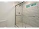 Bathroom showcases a glass-enclosed shower with marble-tiled walls and floor at 4152 Barberry Ne Dr, Roswell, GA 30075