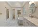 Clean bathroom featuring a standalone tub, marble floors, and vanity at 4152 Barberry Ne Dr, Roswell, GA 30075