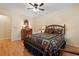 Comfortable bedroom with hardwood floors, natural light, and a traditional style bed at 4152 Barberry Ne Dr, Roswell, GA 30075