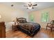 Cozy bedroom with hardwood floors, natural lighting, and a decorative bed frame at 4152 Barberry Ne Dr, Roswell, GA 30075