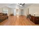 Spacious bonus room with hardwood flooring, and ample natural light streaming through the window at 4152 Barberry Ne Dr, Roswell, GA 30075