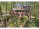 Lovely traditional brick home with blue shutters, set amongst mature trees and landscaping at 4152 Barberry Ne Dr, Roswell, GA 30075