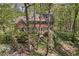 Charming two-story brick home with beautiful landscaping and mature trees offers a serene setting at 4152 Barberry Ne Dr, Roswell, GA 30075