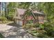 Traditional brick home boasts a two-car garage and manicured lawn at 4152 Barberry Ne Dr, Roswell, GA 30075