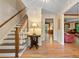 Bright foyer with hardwood floors, stairway and elegant lighting with views to other rooms at 4152 Barberry Ne Dr, Roswell, GA 30075