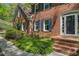 Lovely brick home with inviting front entrance, glass paned door, sidelights and brick steps with walkway at 4152 Barberry Ne Dr, Roswell, GA 30075