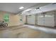 Spacious two car garage with windows providing natural light; enough room for parking and storage at 4152 Barberry Ne Dr, Roswell, GA 30075