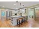 Open kitchen features a large island with bar seating and stainless steel appliances at 4152 Barberry Ne Dr, Roswell, GA 30075