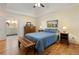 Comfortable bedroom featuring hardwood floors and an ensuite bathroom at 4152 Barberry Ne Dr, Roswell, GA 30075