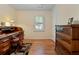 Bright home office with hardwood floors, a built-in desk, and plenty of natural light at 4152 Barberry Ne Dr, Roswell, GA 30075