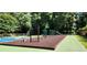 Community playground featuring a variety of play structures including a slide, climbing wall, and swings at 4152 Barberry Ne Dr, Roswell, GA 30075