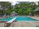 Community pool with a diving board, lounge chairs, and a lifeguard stand on a sunny day at 4152 Barberry Ne Dr, Roswell, GA 30075