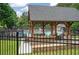 Community pool area featuring a covered pavilion with seating and lounge chairs for relaxation at 4152 Barberry Ne Dr, Roswell, GA 30075