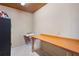 Unfinished basement storage room with a wall mounted craft table and tile flooring at 4152 Barberry Ne Dr, Roswell, GA 30075