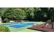 Community tennis and pickleball courts with benches and a playground in a wooded setting at 4152 Barberry Ne Dr, Roswell, GA 30075