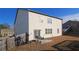 Backyard view with patio, fence, and grill; perfect for outdoor entertaining at 8484 Glenview St, Douglasville, GA 30134