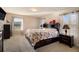 Bright bedroom with plush carpet, a dark wood headboard, and natural light, providing a serene retreat at 8484 Glenview St, Douglasville, GA 30134