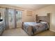 Bedroom with plush carpet, natural light, and a comfortable bed, perfect for relaxation and rest at 8484 Glenview St, Douglasville, GA 30134