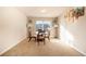 Bright dining room with a glass table and matching chairs; perfect for intimate gatherings at 8484 Glenview St, Douglasville, GA 30134