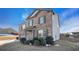 Two-story brick and siding home with mature bushes in the front yard at 8484 Glenview St, Douglasville, GA 30134