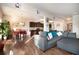 Open concept living area with hardwood floors, dining space, and kitchen, creating an ideal flow for entertaining at 8484 Glenview St, Douglasville, GA 30134