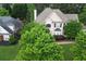 Aerial view of a suburban home showcasing its landscaped yard, proximity to neighbors, and neighborhood layout at 1035 Eagles Brooke Dr, Locust Grove, GA 30248