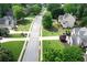 Aerial view of the neighborhood with green lawns and lush trees at 1035 Eagles Brooke Dr, Locust Grove, GA 30248