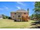 Expansive backyard with a wooden deck and mature landscaping at 1035 Eagles Brooke Dr, Locust Grove, GA 30248
