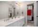 Bright bathroom features double sinks and a shower/tub combo at 1035 Eagles Brooke Dr, Locust Grove, GA 30248
