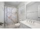 Bright bathroom featuring marble-design shower curtain, white sink vanity, and a large mirror at 1035 Eagles Brooke Dr, Locust Grove, GA 30248