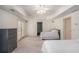 Spacious bedroom with carpet, neutral paint, ceiling fan and with french doors to backyard at 1035 Eagles Brooke Dr, Locust Grove, GA 30248