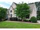 Beautiful home featuring lush landscaping, a well-manicured lawn, and traditional architectural details at 1035 Eagles Brooke Dr, Locust Grove, GA 30248