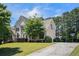 Lovely home with a large lawn, driveway, and attached garage, perfect for suburban living at 1035 Eagles Brooke Dr, Locust Grove, GA 30248