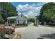 Community entrance gate featuring classic architecture and landscaping at 1035 Eagles Brooke Dr, Locust Grove, GA 30248