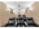 Home theater features comfortable recliners, a projector, and ambient lighting at 1035 Eagles Brooke Dr, Locust Grove, GA 30248