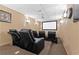 Home theater boasts plush seating and a large screen, perfect for movie nights at 1035 Eagles Brooke Dr, Locust Grove, GA 30248