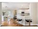 Spacious open kitchen layout with a breakfast bar, marble countertops, and stainless steel appliances at 1035 Eagles Brooke Dr, Locust Grove, GA 30248