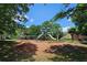Community playground with slides and swings, perfect for Gathering fun in a green, tree-lined setting at 1035 Eagles Brooke Dr, Locust Grove, GA 30248