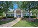 Charming pool house with a green roof, surrounded by lush landscaping and mature trees at 1035 Eagles Brooke Dr, Locust Grove, GA 30248