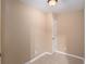 Neutral-colored room with carpet and white trim, and door at 1035 Eagles Brooke Dr, Locust Grove, GA 30248