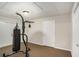 Basement workout room with gym equipment, carpet floor, and double glass doors to outdoors at 1035 Eagles Brooke Dr, Locust Grove, GA 30248