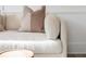 Close-up shot of a stylish cream-colored sofa with decorative pillows, showcasing textures and detail at 1722 Gunnin Nw Trce # 233, Atlanta, GA 30318