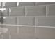 Close-up on the grey backsplash and counter in the kitchen area at 1722 Gunnin Nw Trce # 233, Atlanta, GA 30318