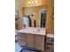 Bathroom vanity with ample storage space beneath the countertop and a decorative mirror at 3102 Aberdeen Cv, Lithonia, GA 30038
