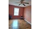 Bedroom featuring laminate flooring, a window, and a ceiling fan at 3102 Aberdeen Cv, Lithonia, GA 30038