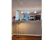 Open kitchen view with breakfast bar and pendant lighting at 3102 Aberdeen Cv, Lithonia, GA 30038